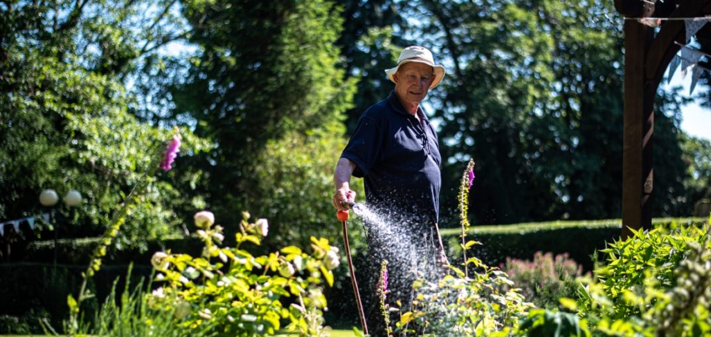 A Brookfields resident tending flowers in the garden